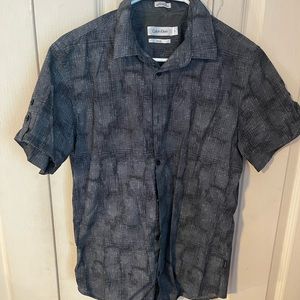 Calvin Klein button down short sleeve shirt, black, size small.